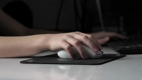 A teenager's hand with a computer mouse . Stock Footage 237744773