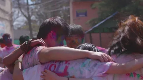 Teenagers having fun during holi festival Stock Footage 77448997