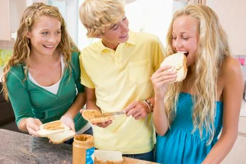Teenagers making sandwiches Stock Photos