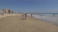 Teenagers playing on the beach, Porto 4k or 4k+ Resolution