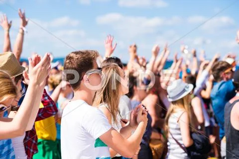 Teenagers At Summer Music Festival Having Good Time
