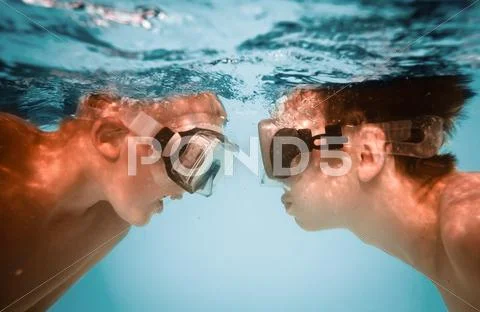Teenagers under water Stock Photos