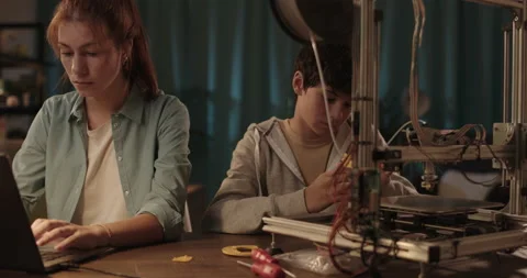 Teenagers using a 3D printer at home Stock Footage 161152831