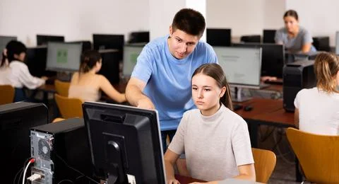 Teenagers using computer during computer science lesson Stock Photos