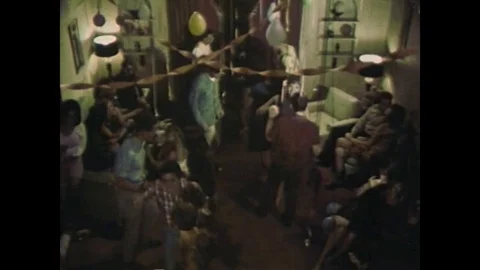 Teens attend a rather corny party in the 1960's, get high, dance and listen to Stock Footage 110729302