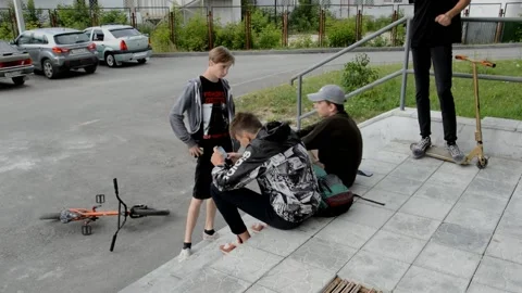 Teens on BMX bikes and scooters Stock Footage 134502453