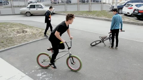 Teens on BMX bikes Stock Footage 131205135