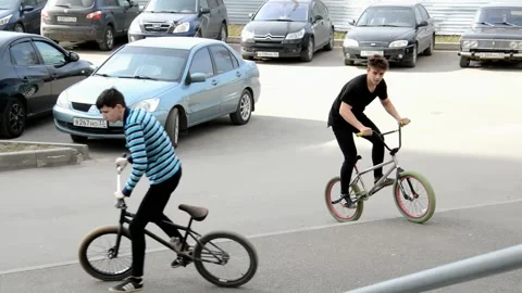 Teens on BMX bikes Stock Footage 131206237