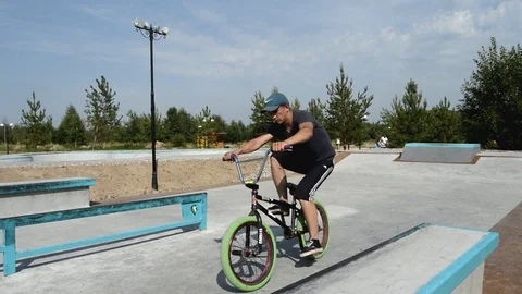 Teens on BMX bikes performs a tricks Stock Footage 101693485