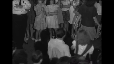 Teens dance to jukebox at recreation center- 1940 Stock Footage 106660580