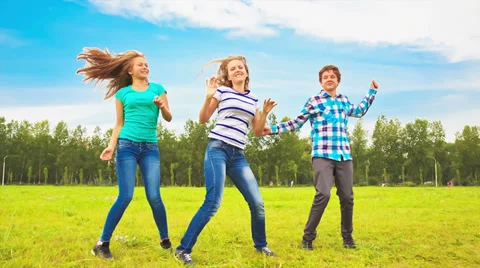 Teens dancing in a meadow Stock Footage