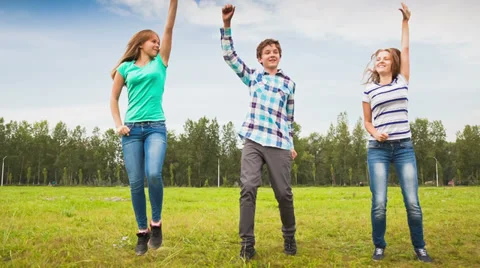Teens dancing in a meadow Stock Footage 35697396