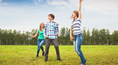 Teens dancing in a meadow Stock Footage 35697424