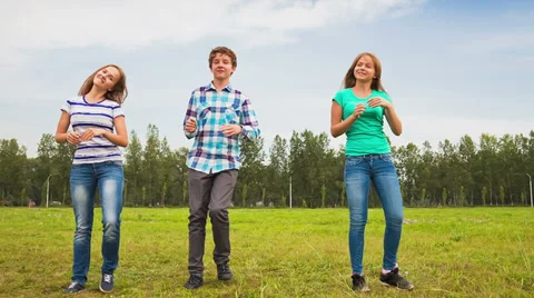 Teens dancing in a meadow Stock Footage 37098803