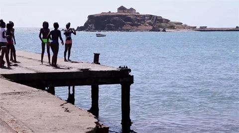 Teens diving from the pier to the sea Stock Footage 55609461