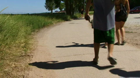 Teens Down Path Near Beach Stock Footage