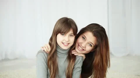 Teens embracing and looking at camera Stock Footage 10717292