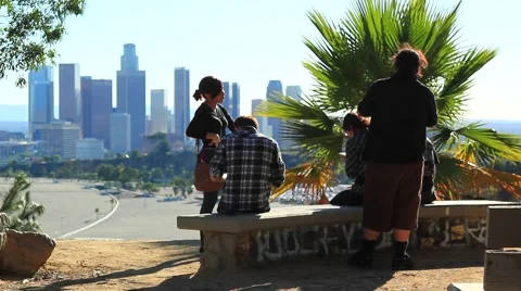 TEENS IN FRONT OF DOWNTOWN Stock Footage 926270