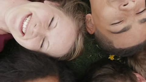 Teens lying on grass Stock Footage 22665002