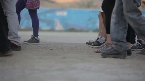 Teens march on dusty road Stock Footage 77053554