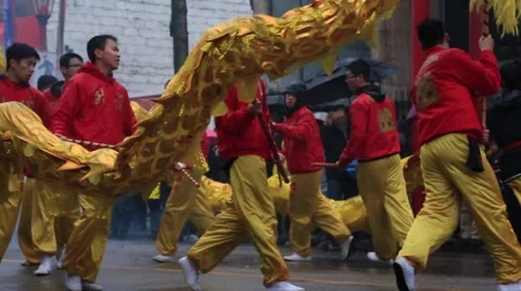 Teens performing traditional dragon dance Stock Footage 60298098