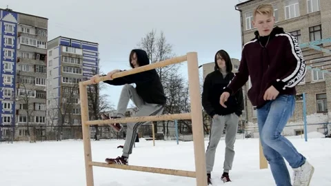 Teens performs trick Stock Footage 130421315