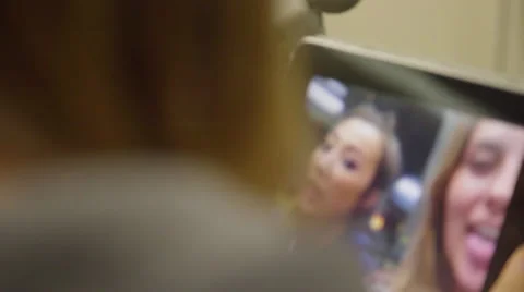 Teens play with an iPad Video stock 54260125