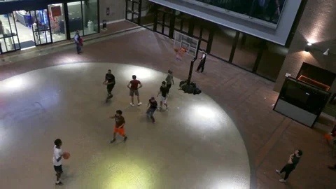 Teens playing basketball Stock Footage 69232685
