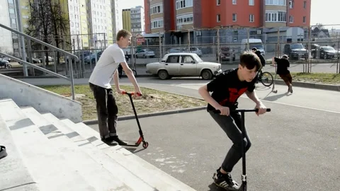 Teens on scooters Stock Footage 131280161