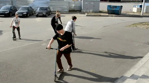 Teens on scooters Stock Footage 131286373