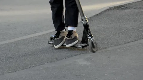 Teens on scooters Stock Footage 133387218