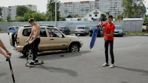 Teens on scooters Stock Footage 134467486
