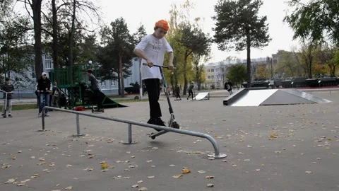 Teens on scooters performs a tricks Stock Footage 280327160