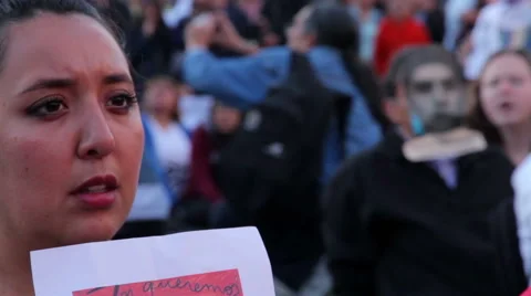 Teens shout slogans in a march protest for the students disappeared in Guerrero. Stock Footage 44265427