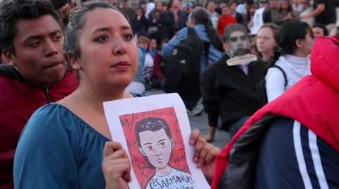 Teens shout slogans in a march protest for the students disappeared in Guerrero. Stock Footage 44265643