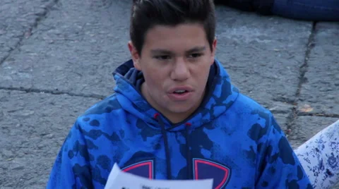 Teens shout slogans in a march protest for the students disappeared in Guerrero. Stock Footage 44268998