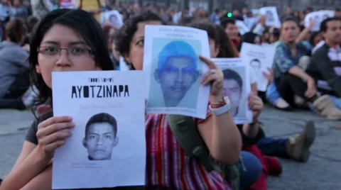 Teens shout slogans in a march protest for the students disappeared in Guerrero. Stock Footage 44269374