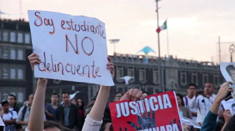 Teens shout slogans in a march protest for the students disappeared in Guerrero. Stock Footage 44269988