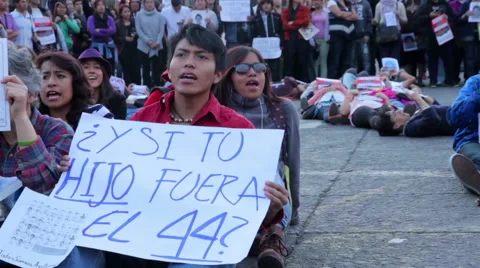 Teens shout slogans in a march protest for the students disappeared in Guerrero. Stock Footage 44272118
