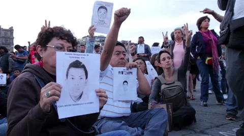 Teens shout slogans in a march protest for the students disappeared in Guerrero. Stock Footage 44313838