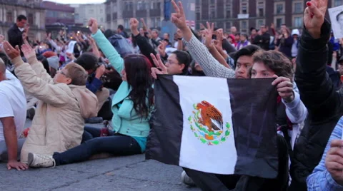 Teens shout slogans in a march protest for the students disappeared in Guerrero. Stock Footage 44323660