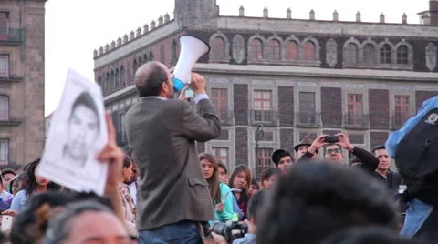 Teens shout slogans in a march protest for the students disappeared in Guerrero. Stock Footage 44360587