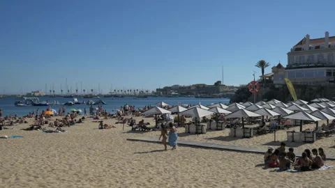 Teens sit in circle at beach in Cascais, Portugal Stock Footage 210772362
