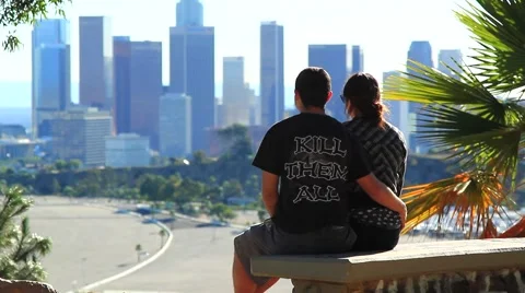 TEENS SIT IN FRONT OF DOWNTOWN A2 Video stock 926228
