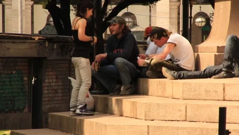 Teens sitting on steps in Sicily Stock Footage 2321566