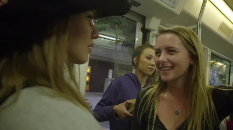 Teens smiling on train Stock Footage 54085737