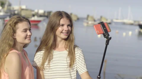 Teens Try To Find The Right Angle To Take Selfies With Their Selfie Stick Stock Footage 57724210