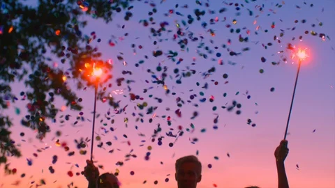 Teens under Confetti rain at the party celebration Stock Footage 98947722