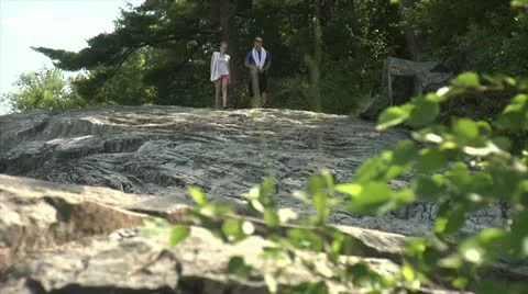 Teens Walking Down Rocks Видео 12063741