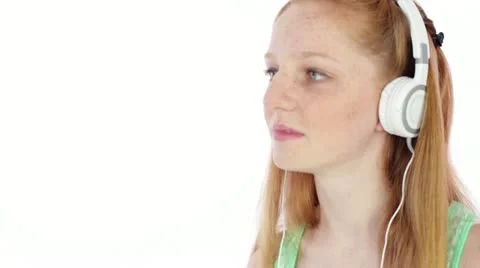 Teen/Tween with Headphones Listening to Music Close Up Stock Footage
